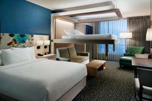 a hotel room with a bed and a bunk bed at TownePlace Suites Nashville Downtown/Capitol District in Nashville