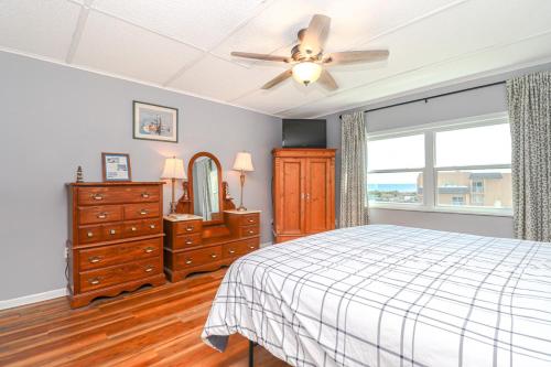 a bedroom with a bed and a dresser and a ceiling fan at Creston House 6E in St. Augustine