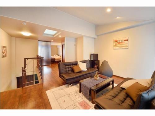 a living room with a couch and a table at Resort Yufuin - Grandpia Resort YUFUIN - - Vacation STAY 73396v in Yufu