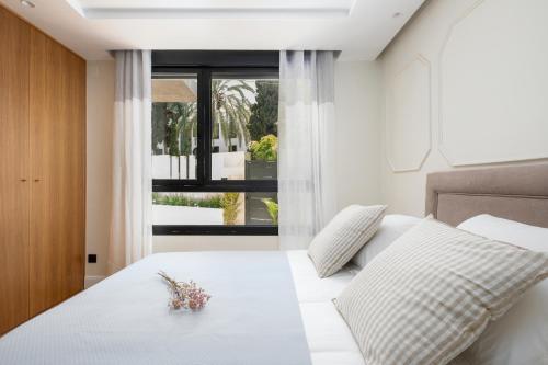 מיטה או מיטות בחדר ב-Apartamentos La Zagalilla
