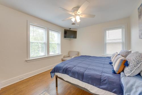 a bedroom with a bed and a ceiling fan at Pet-Friendly St Louis Home with Grill and Backyard in Richmond Heights