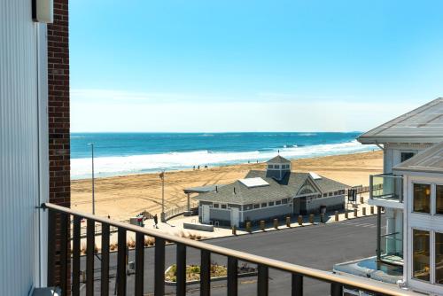 a view of the beach from the balcony of a house at Ashworth by the Sea in Hampton