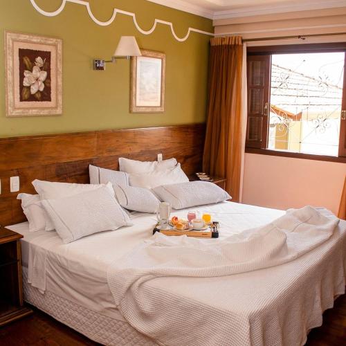 Postel nebo postele na pokoji v ubytování Hotel Dom Otto