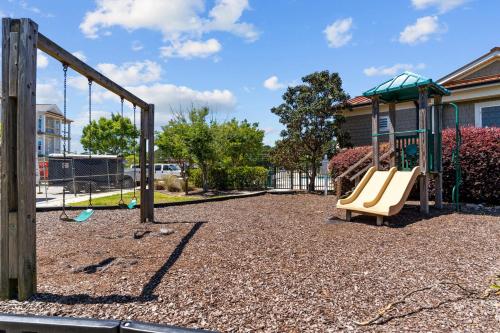 a playground with a slide and a swing at Friends Delight in Calabash