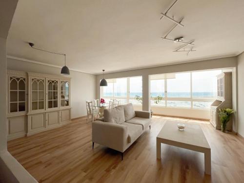 a living room with a couch and a table at Piso en Puerto de Altea in Altea