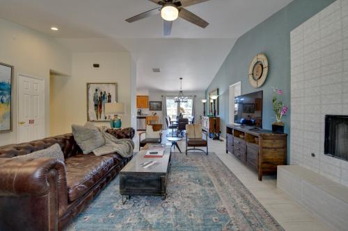 a living room with a couch and a table at Updated Abode 22 Mi to Joshua Tree National Park! in Morongo Valley