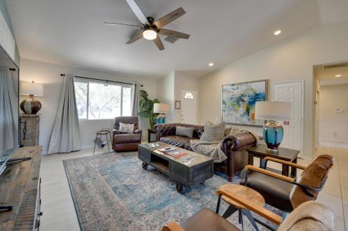 a living room with couches and a ceiling fan at Updated Abode 22 Mi to Joshua Tree National Park! in Morongo Valley