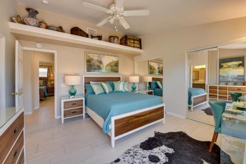 a bedroom with a bed and a living room at Updated Abode 22 Mi to Joshua Tree National Park! in Morongo Valley
