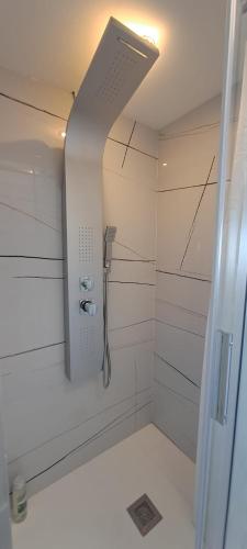 a shower in a white bathroom with a shower at Port 1 in Tarragona