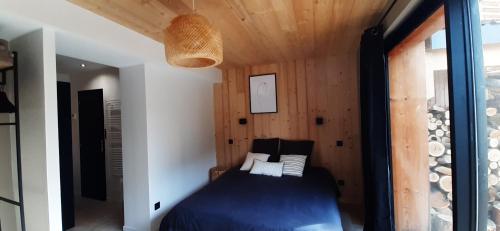 Posteľ alebo postele v izbe v ubytovaní Gîte LES TERRASSES 3