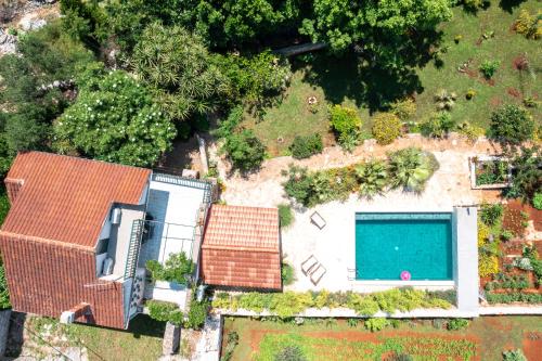 an overhead view of a house with a swimming pool at Mai's Cottage in Stari Grad