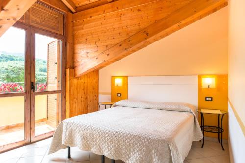 Posteľ alebo postele v izbe v ubytovaní B&B Il Girasole