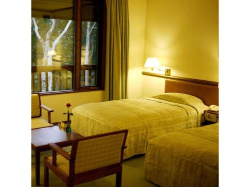 Een bed of bedden in een kamer bij Sukayu Onsen Hakkoda Hotel - Vacation STAY 66846v