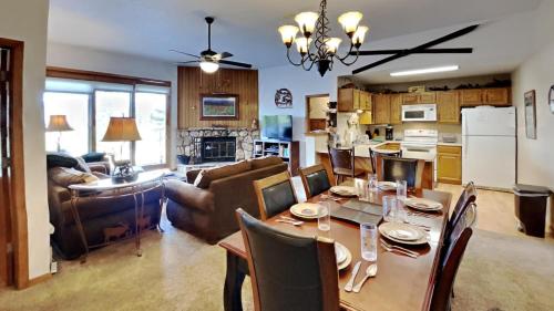 a kitchen and living room with a table and chairs at CC102 Buffalo Village in Silverthorne