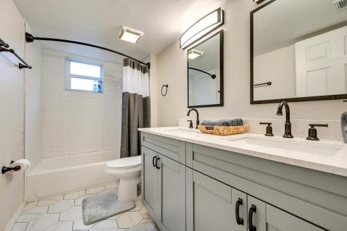 a bathroom with a sink and a toilet and a tub at WFH-Friendly Tampa Home Rental 2 Mi to Downtown! in Tampa