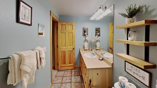 a bathroom with a sink and a toilet at Tenderfoot Lodge 2616 in Keystone