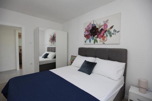 מיטה או מיטות בחדר ב-Blue Sky Trogir