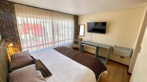 Ένα ή περισσότερα κρεβάτια σε δωμάτιο στο Hotel Canto del Mar
