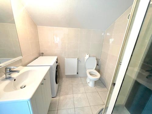 Et badeværelse på Appartement L'Annexe City - 3 étoiles