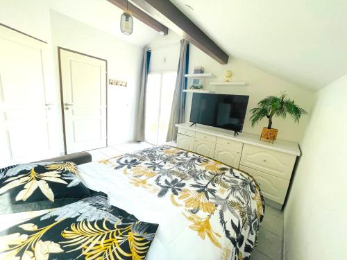 En eller flere senge i et værelse på Appartement L'Annexe City - 3 étoiles