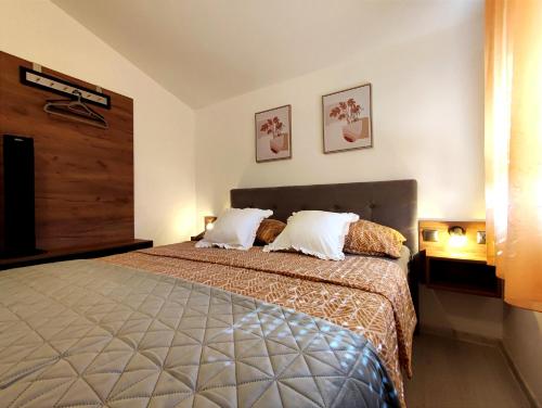 Apartments Jolić tesisinde bir odada yatak veya yataklar