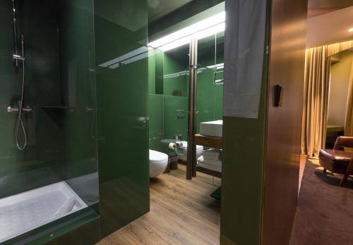 a bathroom with a shower and a sink at Figueira by The Beautique Hotels in Lisbon