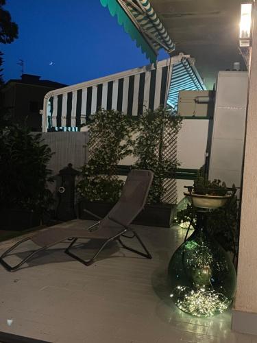 a chair sitting on a patio at night at Belappart in Fiuggi
