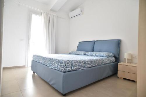 Postel nebo postele na pokoji v ubytování Appartamento Oasi con Piscina