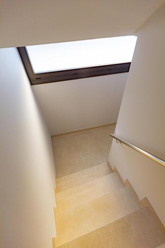 a stairwell with a skylight in a house at Apartamentos Villa Zoila Nigrán in Nigrán
