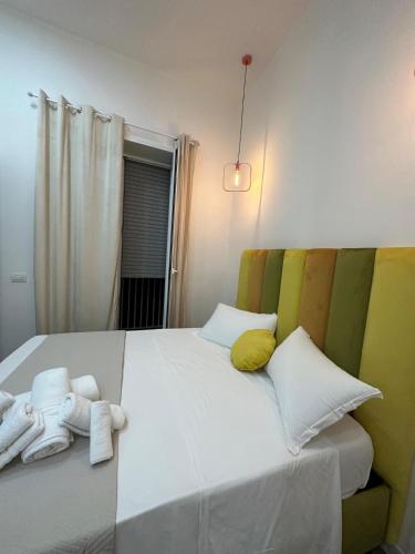 a bedroom with a bed with towels on it at San Ferdinando suite room in Naples