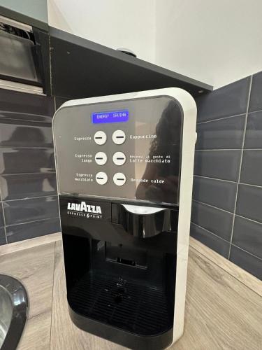 a kiwiana coffee machine in a kitchen at San Ferdinando suite room in Naples