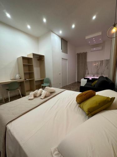 a bedroom with two beds with towels on them at San Ferdinando suite room in Naples
