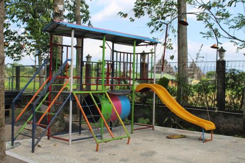 a playground with a slide in a park at Georium Dunia in Prambanan