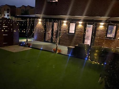 a green dance floor with lights in a building at semi-detached houses in Manchester