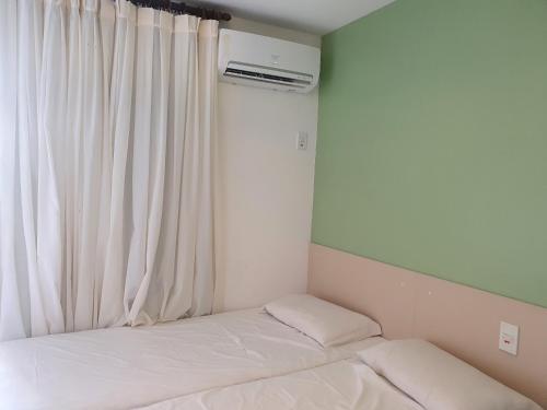 Katil atau katil-katil dalam bilik di Gran Lençóis Flat Residen