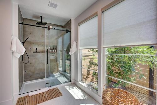 a bathroom with a shower and a glass shower stall at Off-Broadway - Modern woutdoor haven in Boise