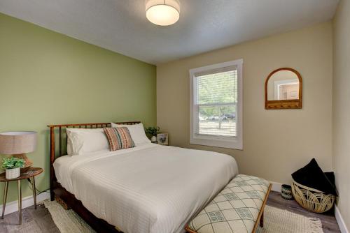 a bedroom with a bed and a window at Off-Broadway - Modern woutdoor haven in Boise