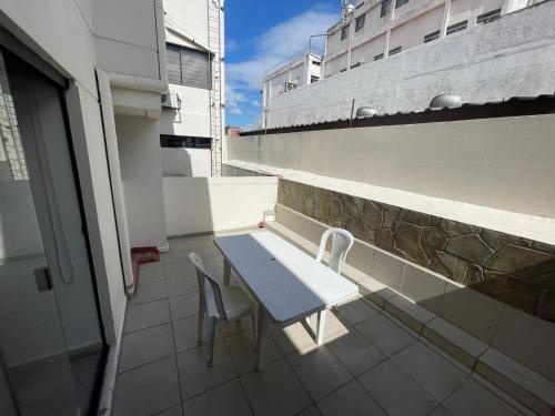 a table and chairs on the balcony of a building at Tradición in Santa Cruz de la Sierra