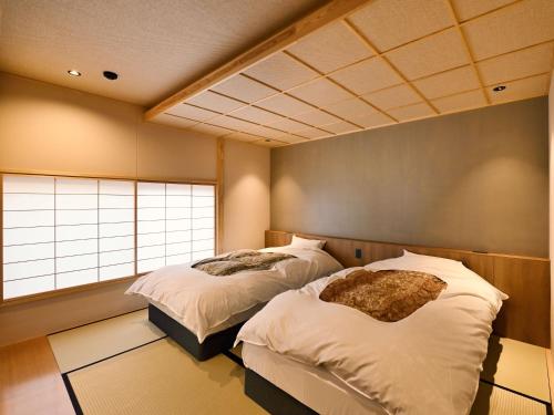Ein Bett oder Betten in einem Zimmer der Unterkunft Beniya