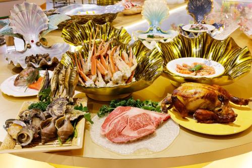 a table with many different types of food on it at ホテル　ロモサ in Minakami