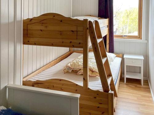 a bedroom with two bunk beds in a room at 6 person holiday home in Ånneland-By Traum in Ånneland