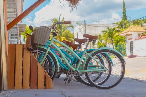 a green bike parked next to a building at Hotel Bacalar Magico in Bacalar