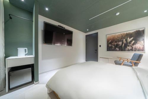 Croissant Hotel Guri by Aankにあるベッド