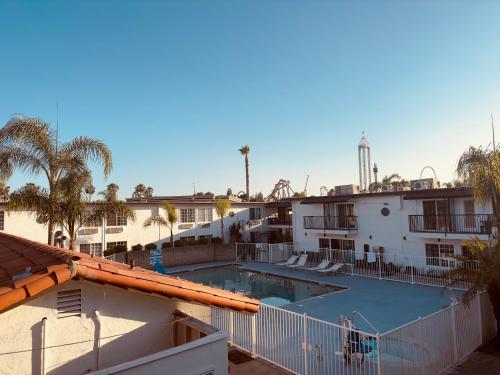 a view of the pool from the balcony of a hotel at THE BERRY INN in Buena Park