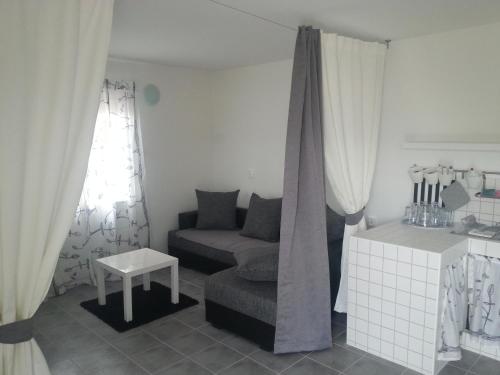 a living room with a couch and a table at Apartments Paro in Pag