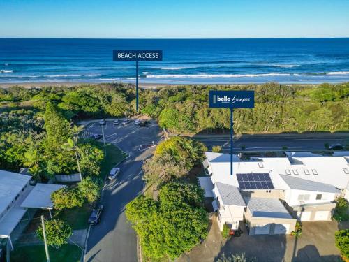 an aerial view of a beach house and the ocean at Unit 1 Marcoola Shores in Marcoola