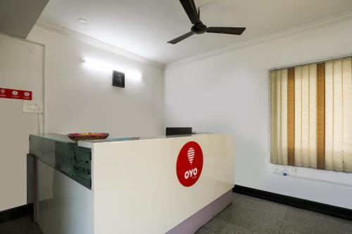 a white room with a coca cola sign on the wall at Flagship Hotel Sr Residency in Vijayawāda