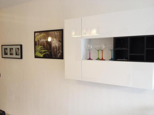 a room with wine glasses on a wall at Beach Suite Playa Cala dor in Cala d´Or