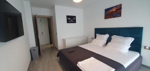 Giường trong phòng chung tại Apartament Sienna - Mamaia Nord