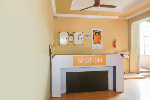 a fireplace in a room with a sign on it at OYO Hotel Prince Residency in Vellore